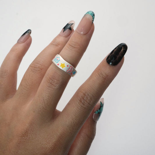Cosmic Pop Ring worn on hand, playful silver enamel ring with bright designs