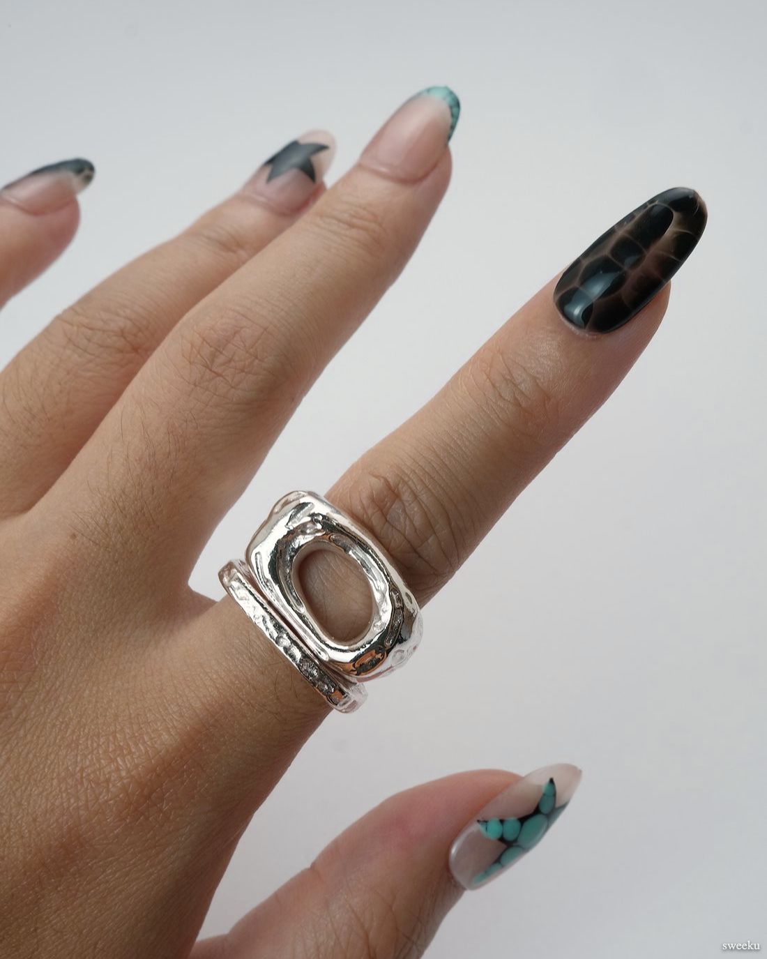 Echo Form Ring Set worn on hand showing open-form and textured silver bands