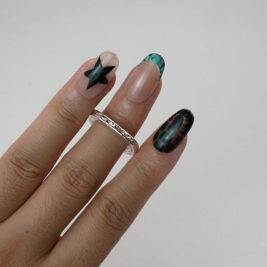 Echo Form Ring Set worn on hand showing open-form and textured silver bands