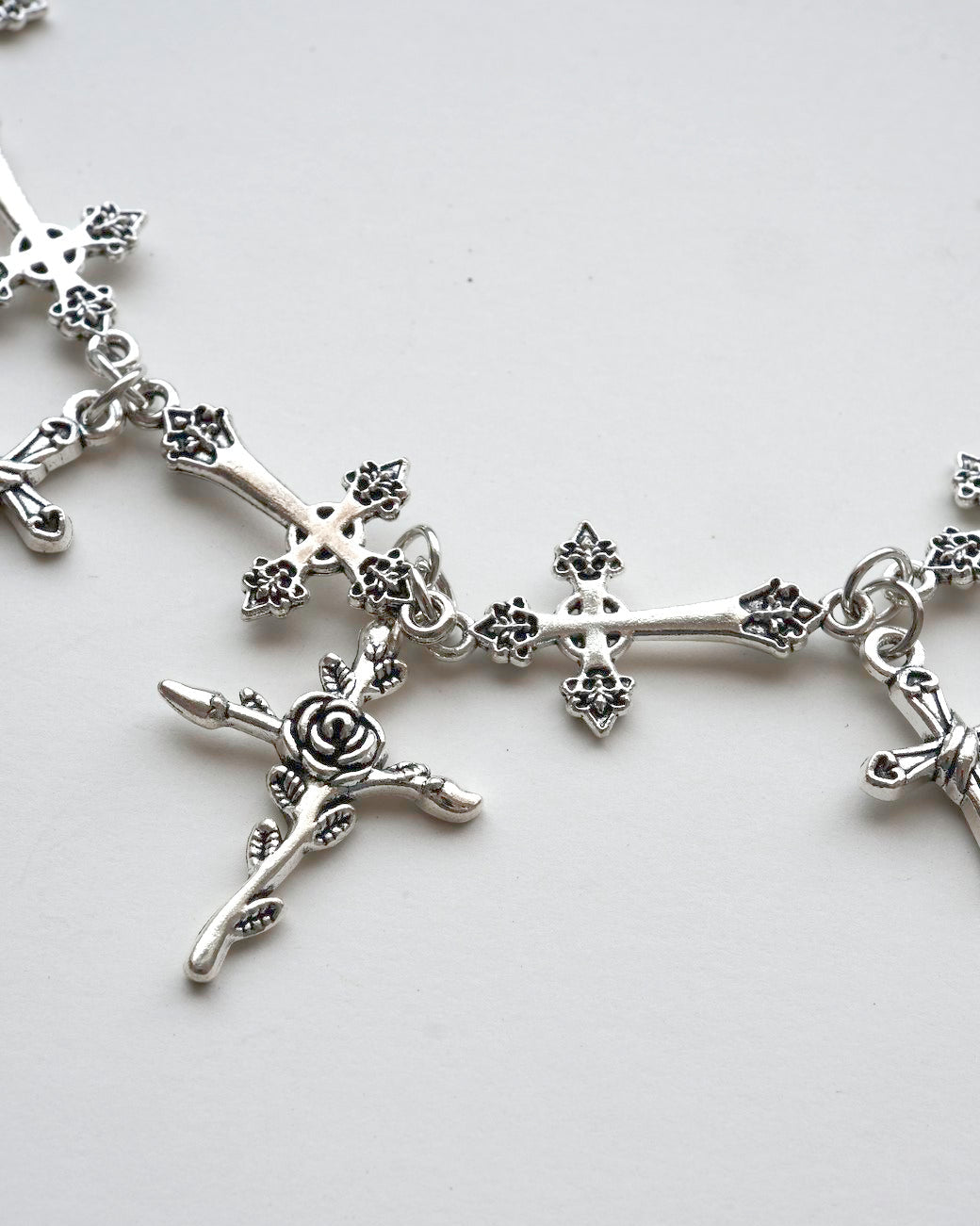 A gothic alloy chain necklace with various cross and rose charms detail - SWEEKU jewelry