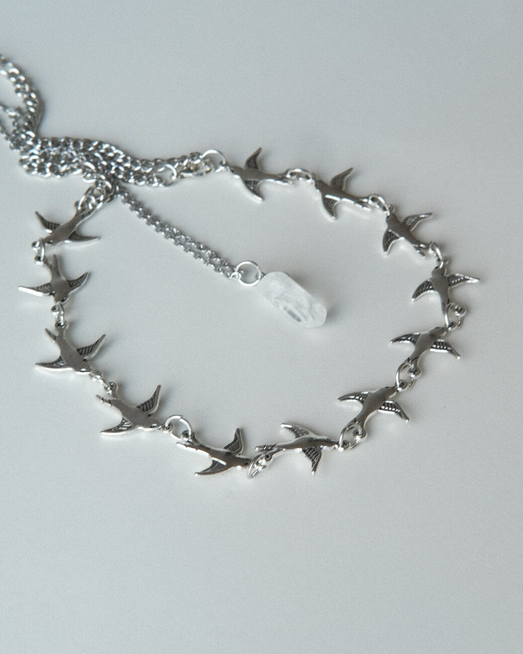 Layered necklace set with a bird chain link choker and a separate crystal pendant necklace - detail - front view - SWEEKU jewelry