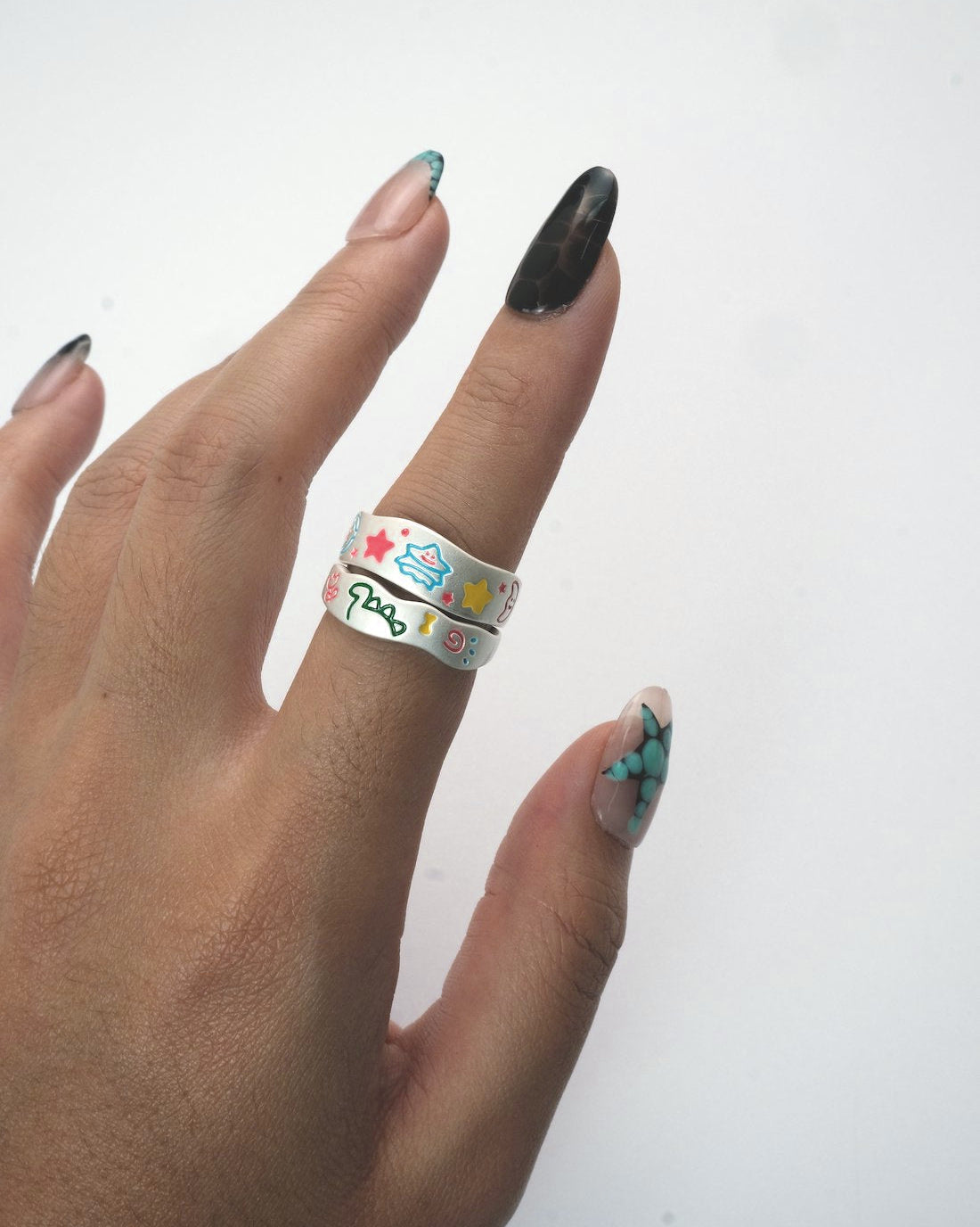 Cosmic Duo Ring Combo featuring two adjustable silver enamel rings with colorful designs
