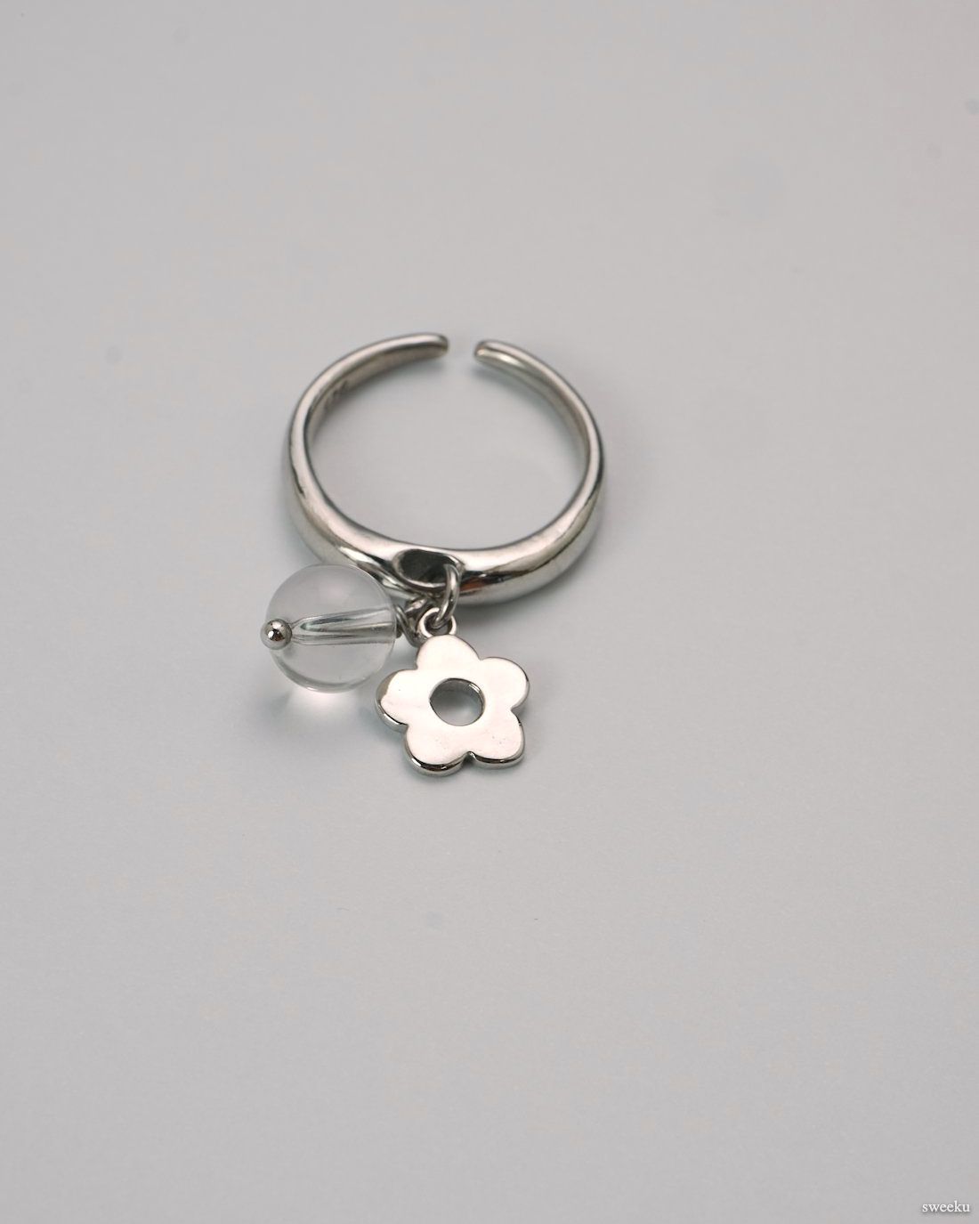 Dew Bloom Ring worn on hand, silver-plated adjustable ring with dangling charm and bead