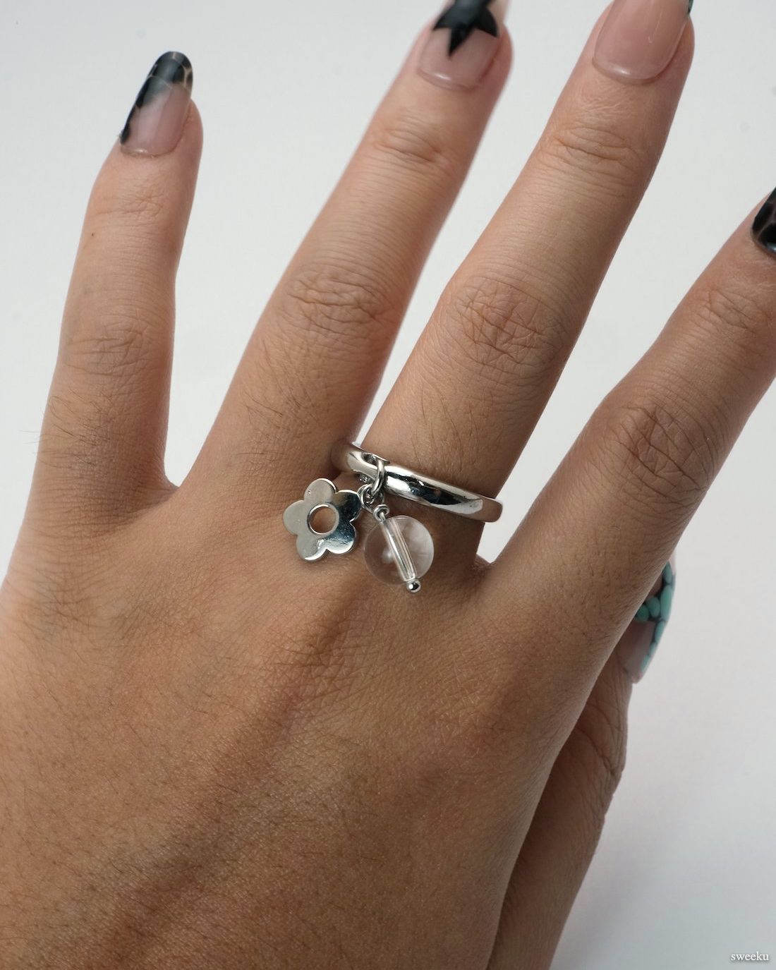 Dew Bloom Ring worn on hand, silver-plated adjustable ring with dangling charm and bead