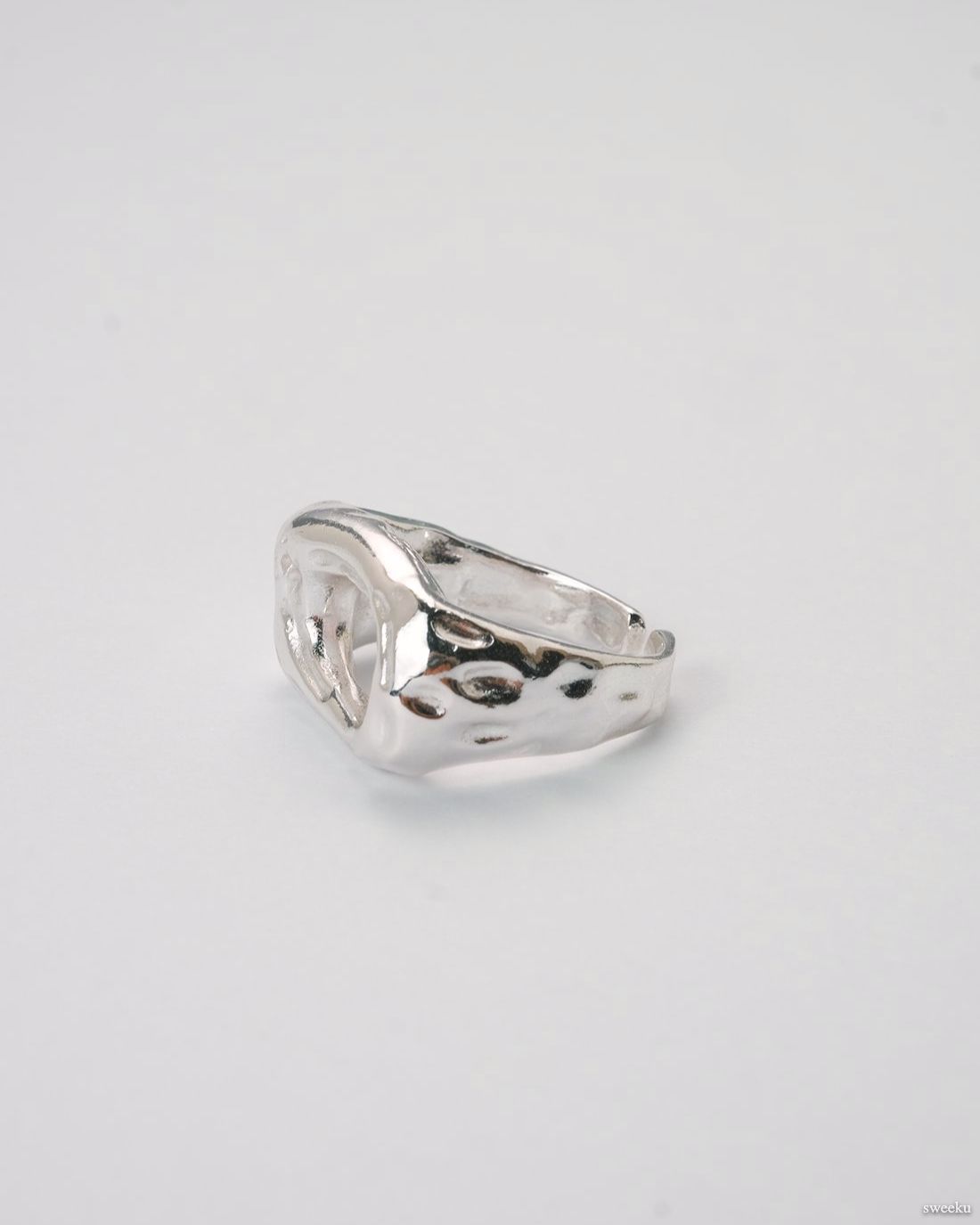 Echo Form Ring Set featuring silver sculptural and hammered adjustable rings