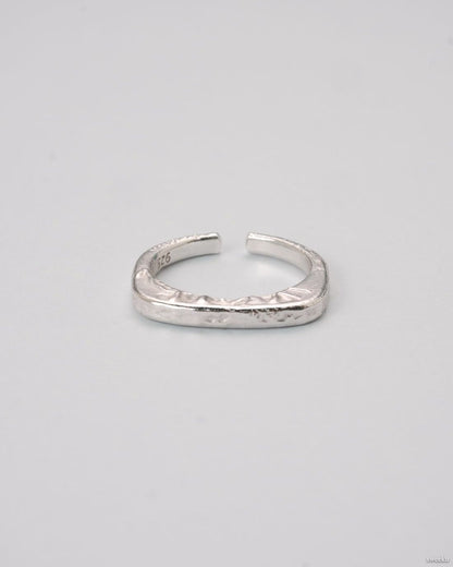 Echo Form Ring Set featuring silver sculptural and hammered adjustable rings