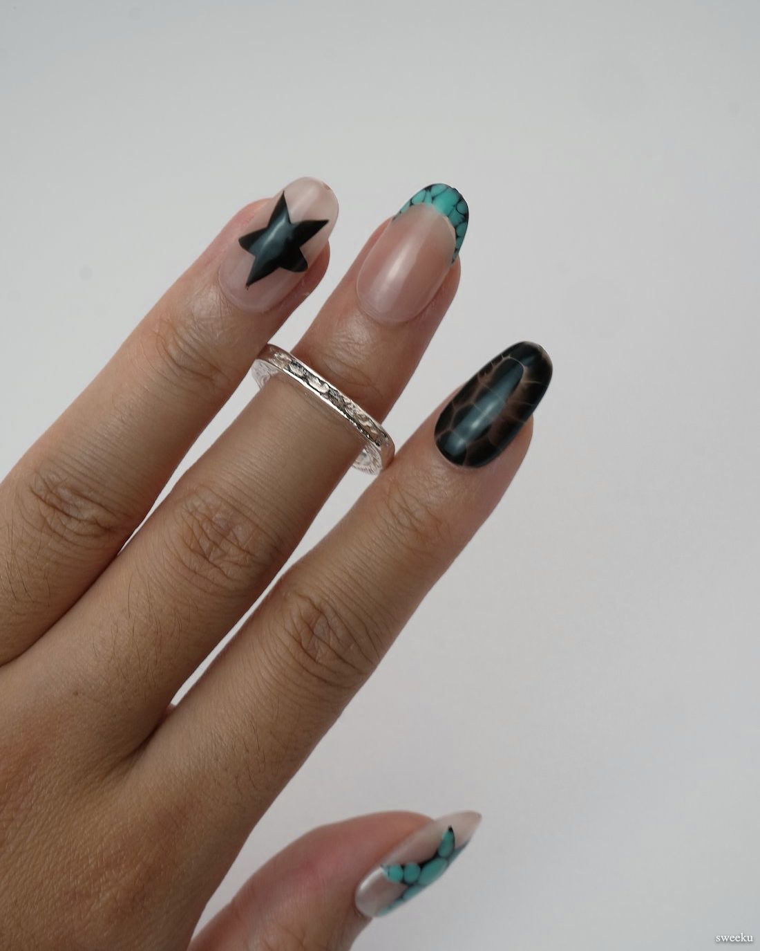 Echo Form Ring Set worn on hand showing open-form and textured silver bands