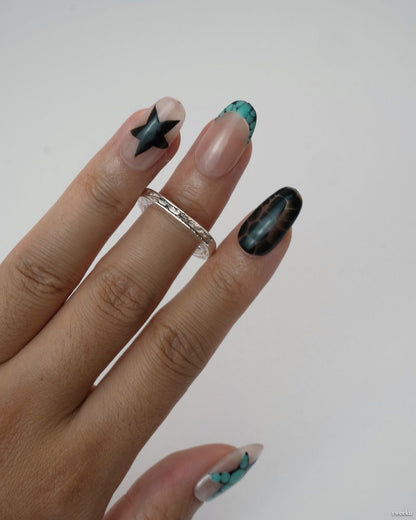 Echo Form Ring Set worn on hand showing open-form and textured silver bands