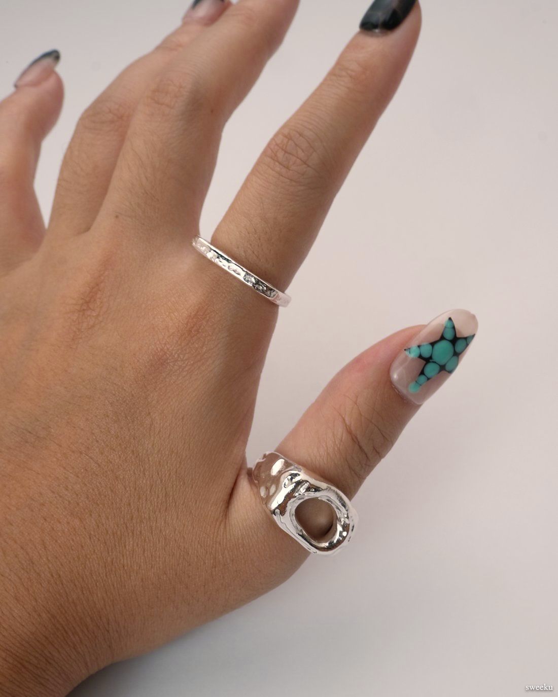 Echo Form Ring Set worn on hand showing open-form and textured silver bands