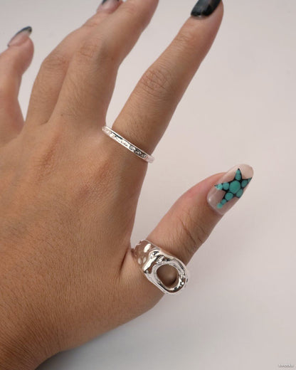 Echo Form Ring Set worn on hand showing open-form and textured silver bands