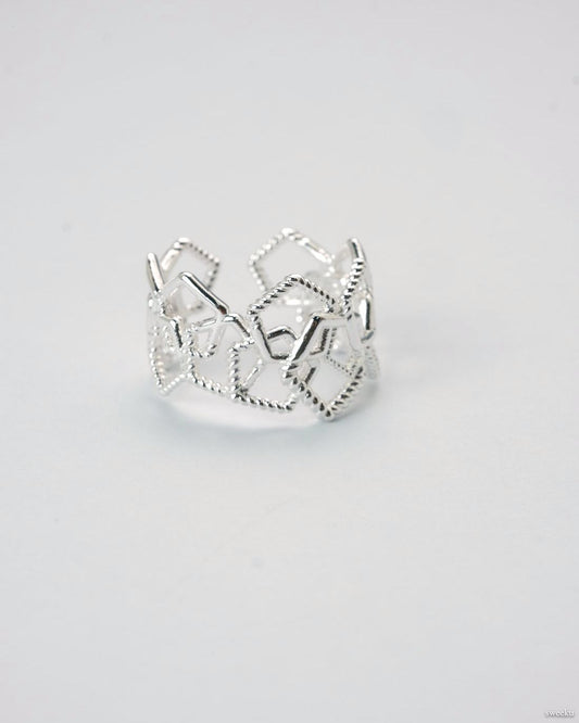 Adjustable silver geometric open lattice ring on white background