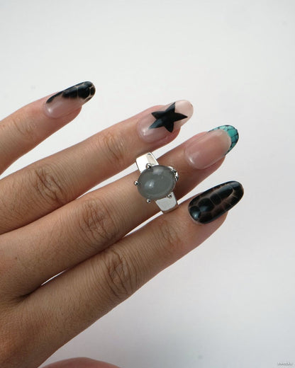 Luna Mist Ring worn on hand, minimalist silver-plated ring with round grey stone accent