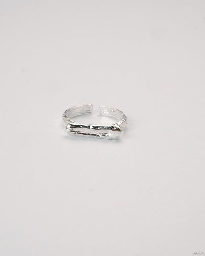 Molten Line Ring with organic silver ridge design and adjustable band.