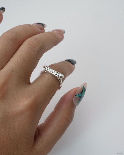 Molten Line Ring worn on hand, modern sculptural silver-plated ring