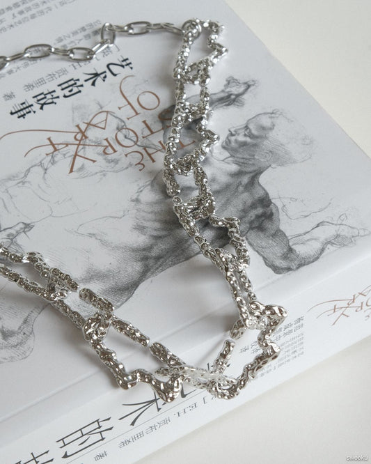 silver molten texture chain necklace on book background, adjustable length