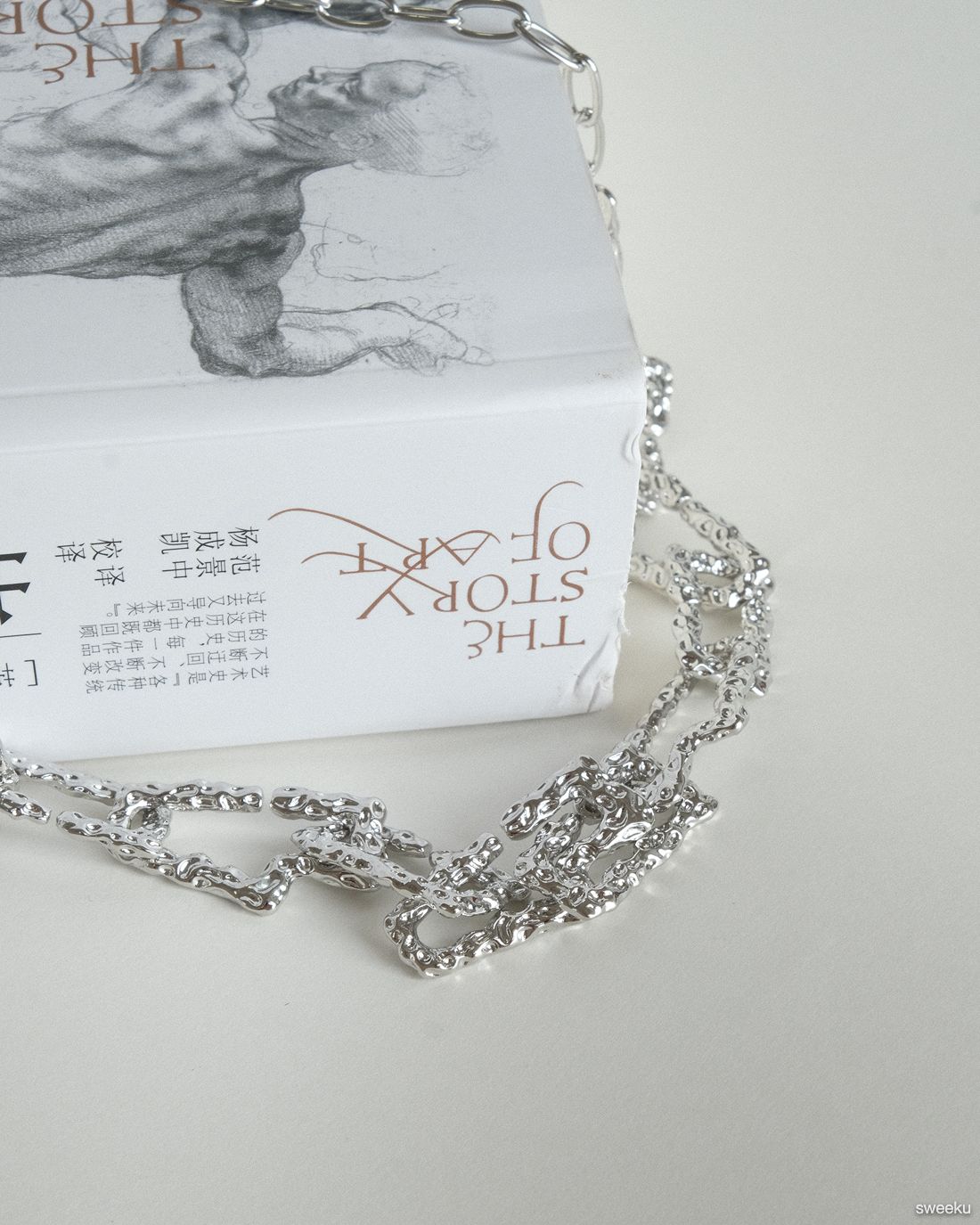 silver molten texture chain necklace on book background, adjustable length