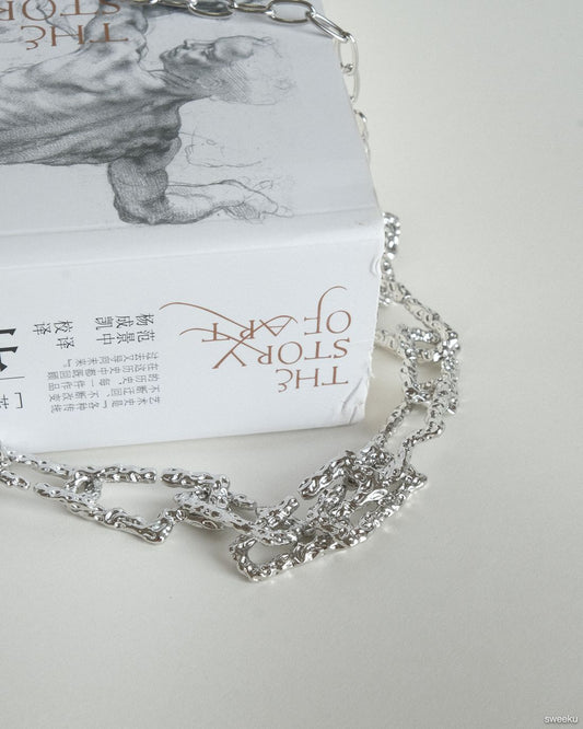 silver molten texture chain necklace on book background, adjustable length