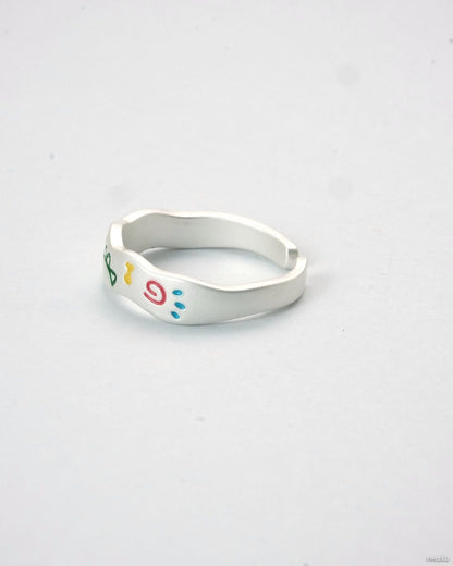 Adjustable silver enamel ring with colorful doodle design