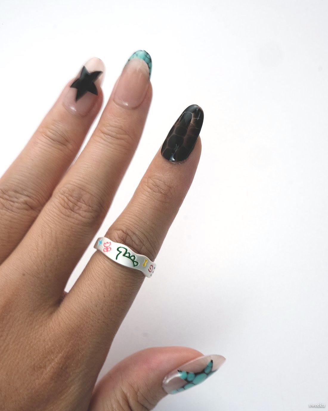 Neon Whirl Ring worn on hand, fun abstract enamel pattern on silver band