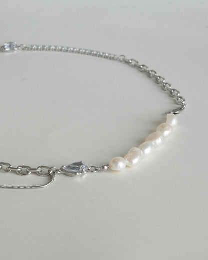 Asymmetrical pearl and zirconia necklace with a mix of chains, beads, and polished bars - detail - pearl - side view - SWEEKU jewelry
