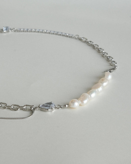 Asymmetrical pearl and zirconia necklace with a mix of chains, beads, and polished bars - detail - pearl - side view - SWEEKU jewelry