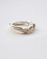 Braided sculptural metal ring with a twisted design and polished finish – side view – SWEEKU jewelry