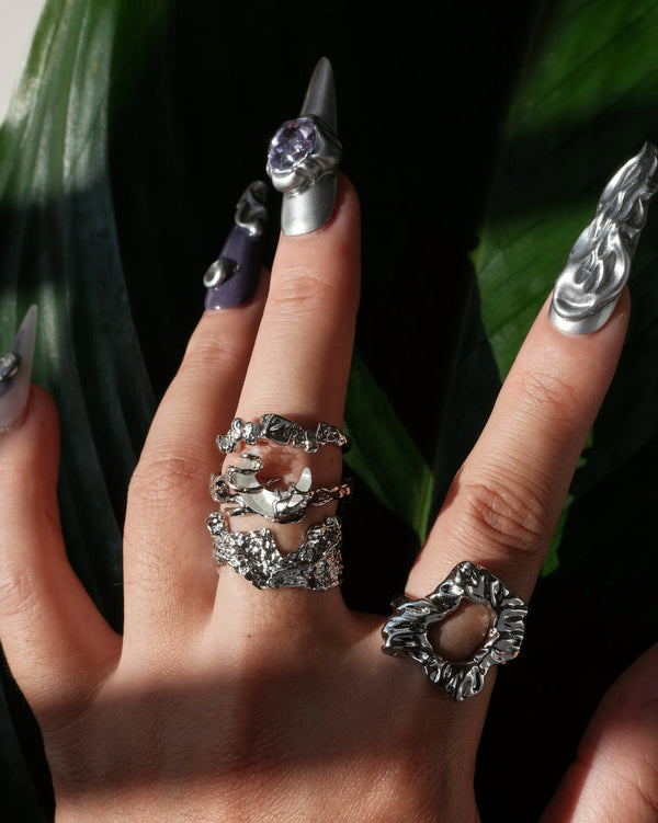 Model wearing dragon claw ring with an adjustable open band and a clear crystal centerpiece – front view – SWEEKU jewelry
