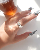 Model wearing hammered copper adjustable ring with an open band and a small polished star detail – side view – SWEEKU jewelry
