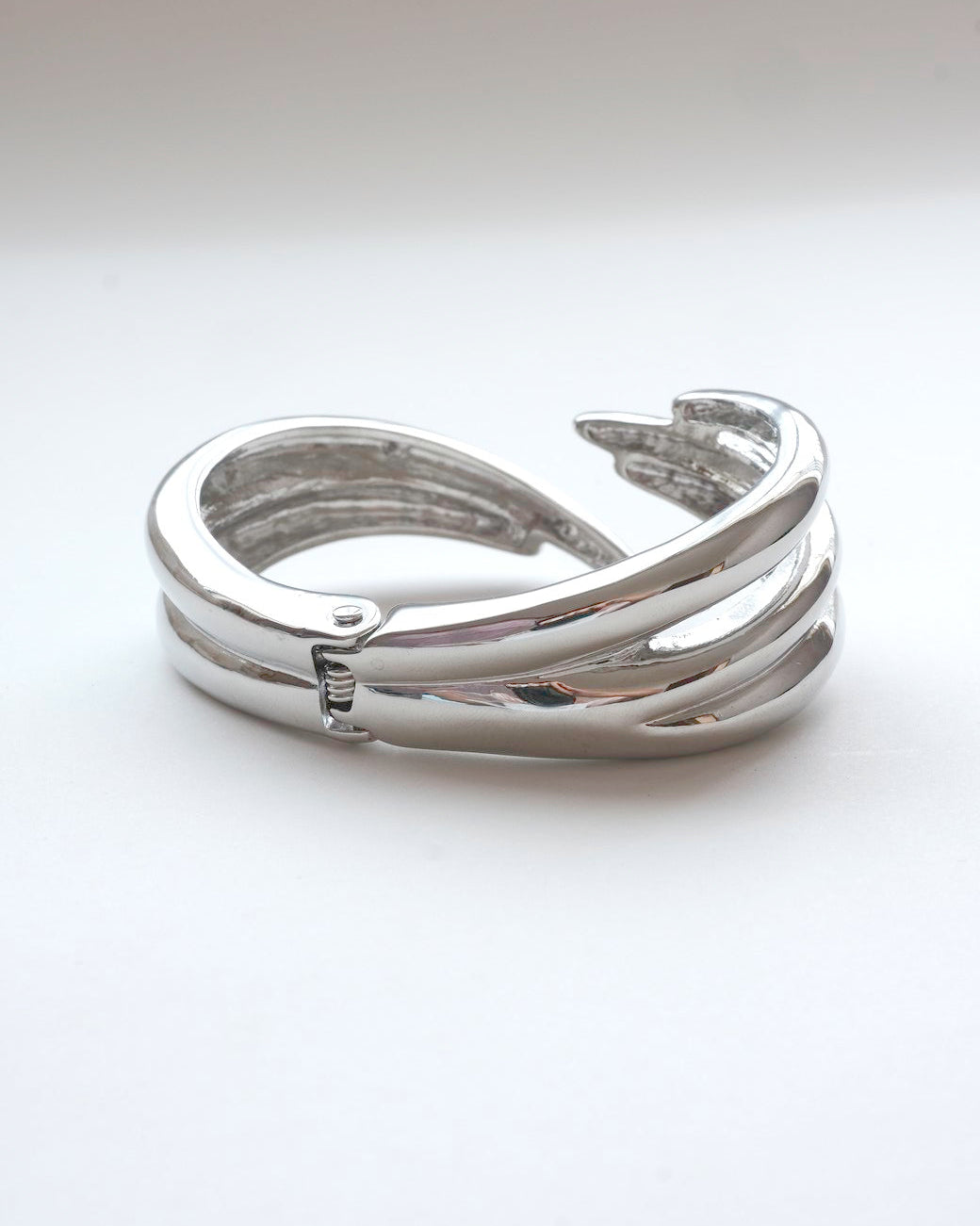 Liquid metal sculptural bracelet featuring a bold, multi-layered claw design - back view - SWEEKU jewelry