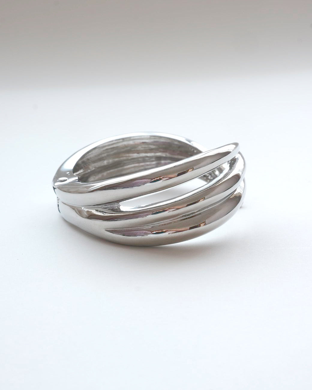 Liquid metal sculptural bracelet featuring a bold, multi-layered claw design - side view - SWEEKU jewelry