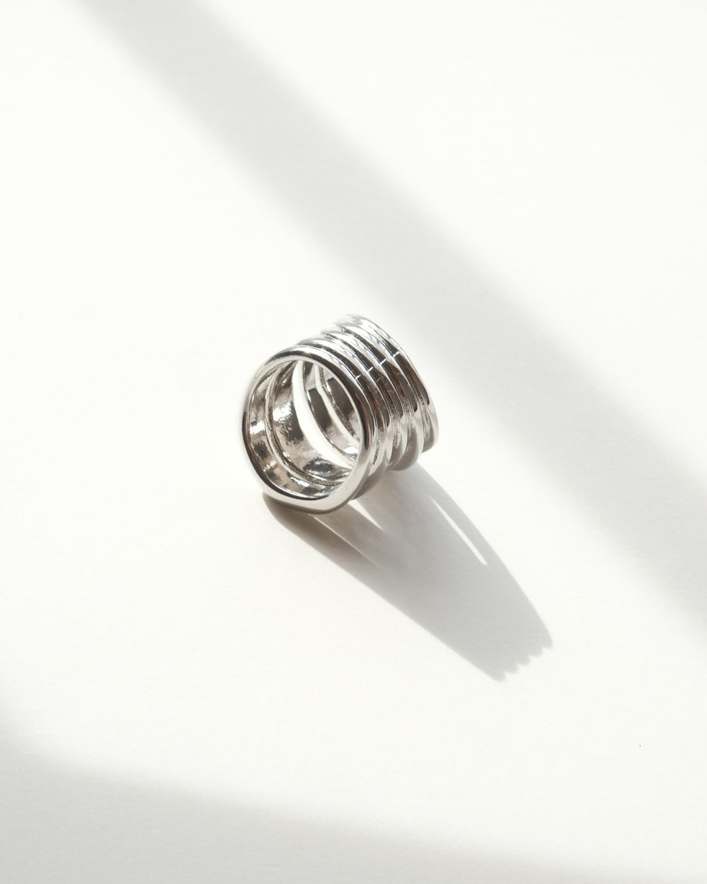 Multi-layer sculptural statement ring with a polished, stacked band design – back view – SWEEKU jewelry
