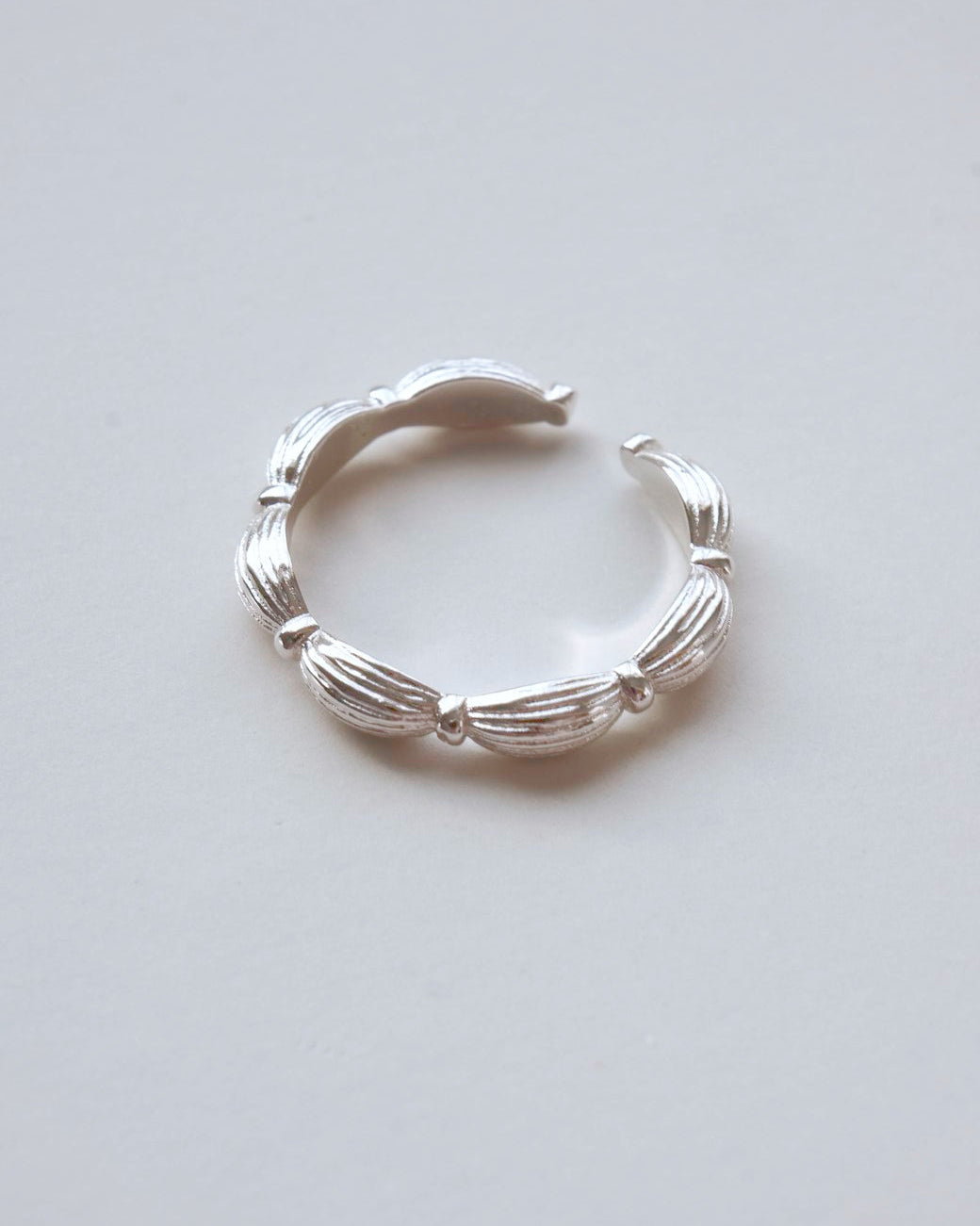 Ribbed copper adjustable ring with an open band and a small domed design – detail– SWEEKU jewelry