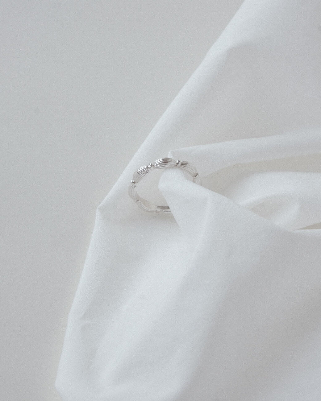 Ribbed copper adjustable ring with an open band and a small domed design – side view – SWEEKU jewelry