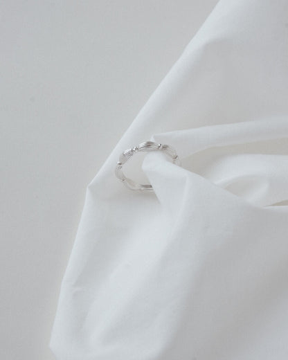 Ribbed copper adjustable ring with an open band and a small domed design – side view – SWEEKU jewelry