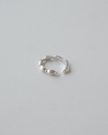 Sand-textured chunky adjustable ring with a sculptural, fluid design – front view – SWEEKU jewelry
