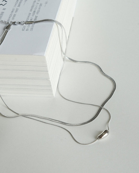 Two-layer snake chain necklace with a small, polished tear drop pendant - front view - 1st- SWEEKU jewelry
