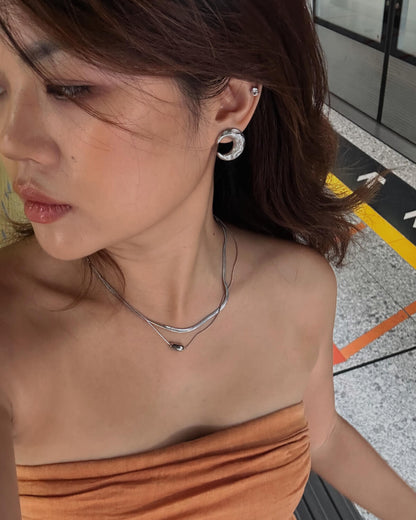 Model wearing two-layer snake chain necklace with a small, polished tear drop pendant - front view - SWEEKU jewelry
