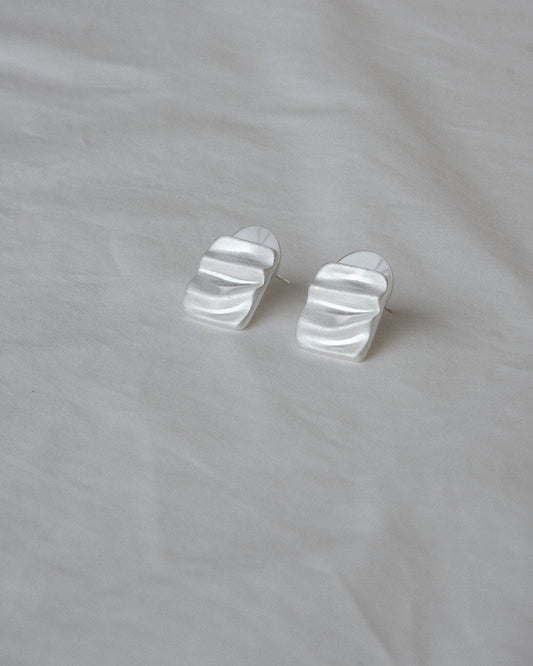 Pair of wavy rectangle copper stud earrings with silver posts and a textured, modern design - front view 2 - SWEEKU jewelry