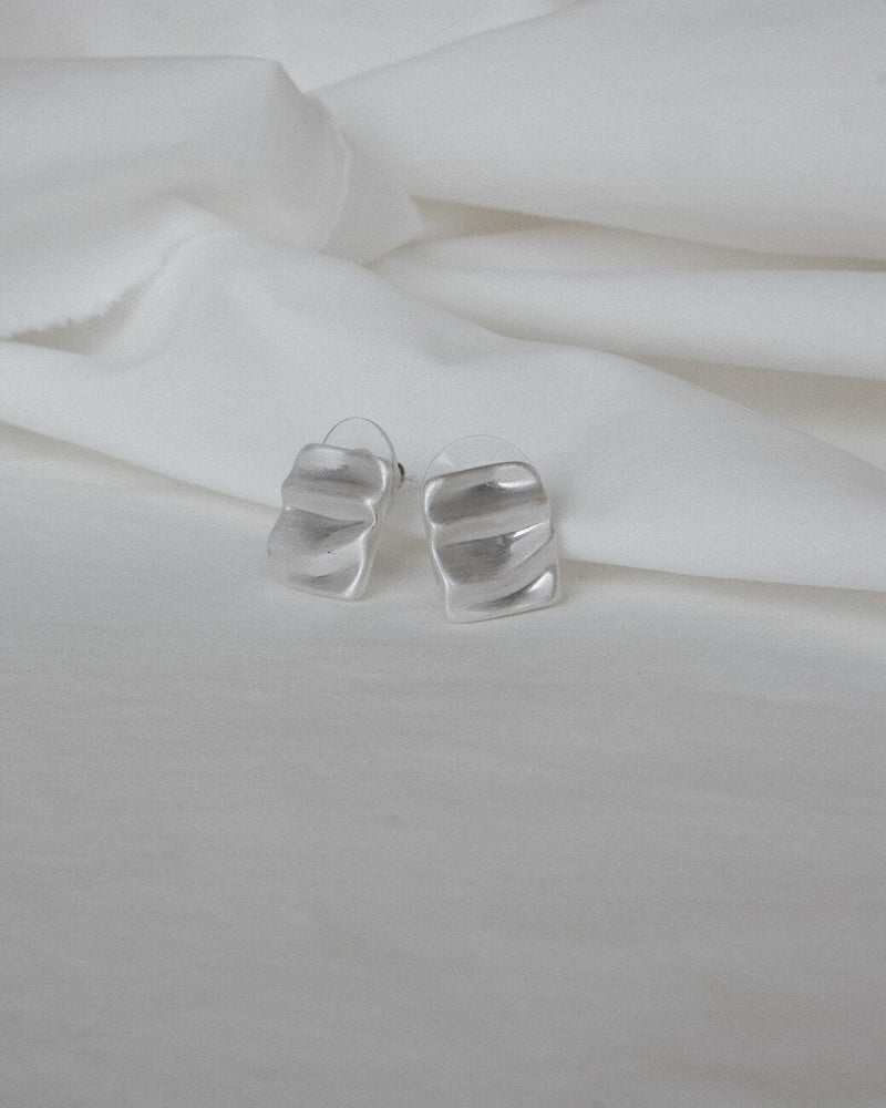 Pair of wavy rectangle copper stud earrings with silver posts and a textured, modern design - front view - SWEEKU jewelry
