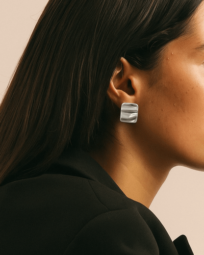 Model wearing pair of wavy rectangle copper stud earrings with silver posts and a textured, modern design - side view - SWEEKU jewelry