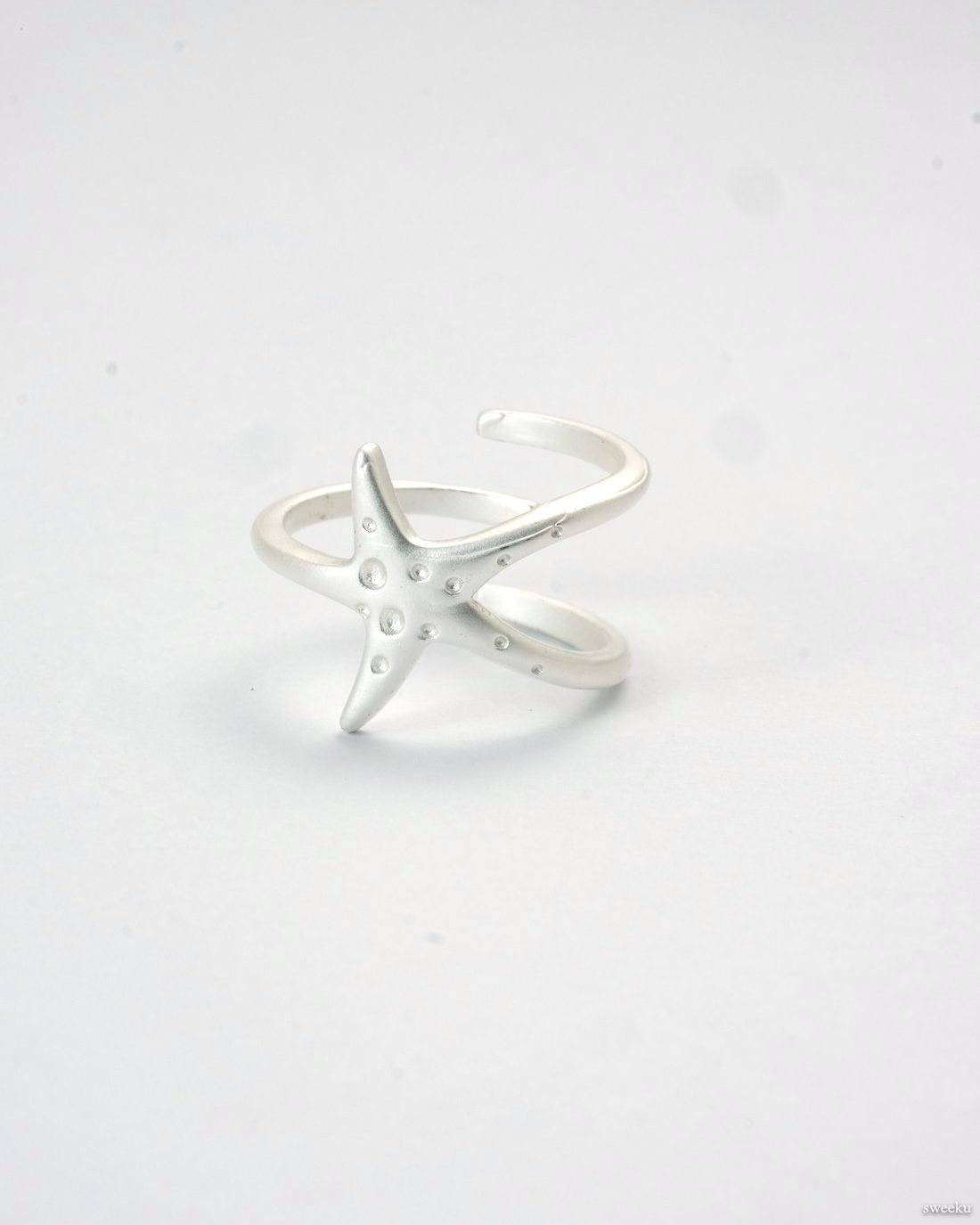 Tidal Star Ring with silver starfish design and adjustable band